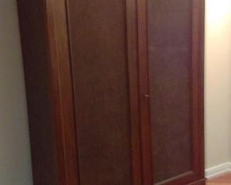 Armoire with 2 drawers on the bottom. Solid back