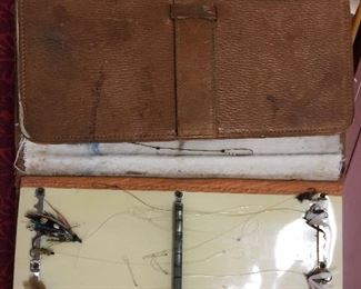Antique leather fly keeper with a lot of flies