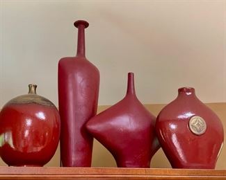 54. 8 Assorted Shaped Red Glazed Vessels