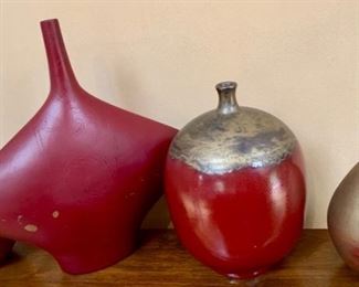 54. 8 Assorted Shaped Red Glazed Vessels