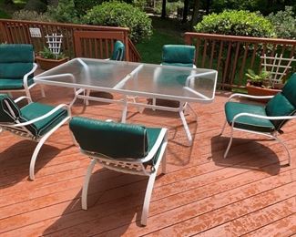 77. White Powder-Coated Aluminum Outdoor Dining Set: Rectangular Table w/ Textured Glass Top (85" x 43" x 28") w/ 6 Armchairs w/ Green All Weather Cushions