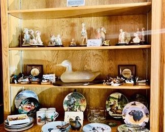 Carved hand-painted ducks plates and statue