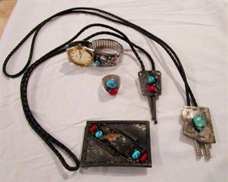 Navajo sterling jewelry with turquoise, red coral and bear claw incorporated into the belt buckle.