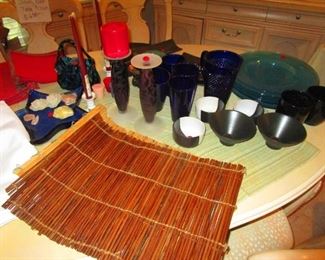 Bamboo place mats and black ceramic Japanese soup bowls and cups