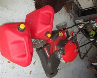 gas cans and mower