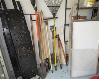 Garden tools, car repair drive up ramps and case of new ceiling panels