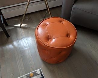 Orange vinyl/leather ottoman