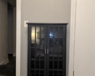 Small dark gray glass cabinet