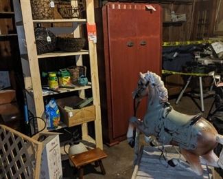 Antique armoire, wood shelve, misc garden items, outdoor wood cart, old plastic pony and more