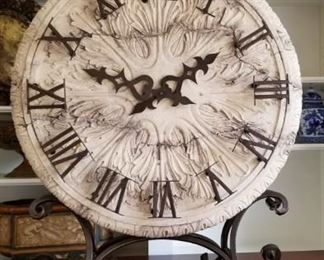 large decorative clock on iron stand (stone-like clock face), 34 " tall,  26" wide