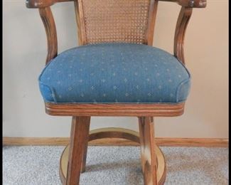 Solid Oak  with Caned Back and brass trim Swivel Bar Stools. There are six of these and they are like new.  Originally purchased at Pete's Billiards. 