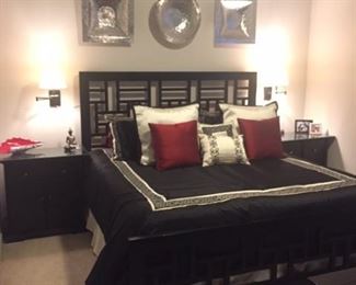 Broyhill 6-piece king-sized bedroom set in black. Set includes the bed headboard and footboard, the two nightstands with custom-cut glass for protection pictured here, tall dresser/chest, dresser and mirror. (TempurPedic mattress set is available separately but not included in the bedroom set).