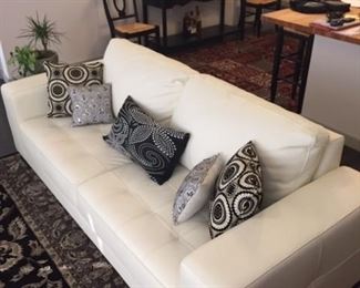 Ivory leather sofa from Copenhagen Imports.  The sofa has a completely finished back making it suitable for floating.  Like new, perfect condition.