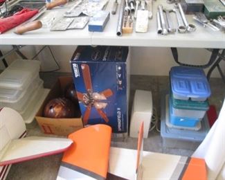 Storage Containers. Under Table is a Boxed Ceiling Fan, "Harbor Breeze" Springfield II, 52", Brushed Nickel Finish.