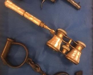 Opera glasses, shackles, antique pistol 