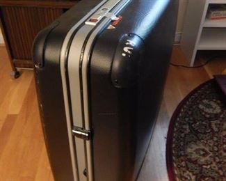 Large luggage on wheels.