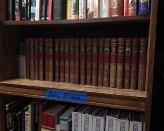 Three book shelves of books.