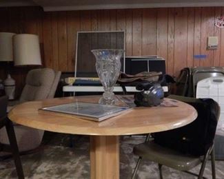 Round wooden table , leaves fold down.