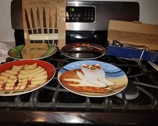 Collectible cat plates from the 1980'. Kershaw steak knives. Flatware.