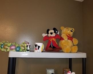Easter wreath. Sorcerer Mickey and Winnie the Pooh plushes. Sylvester and Tweety cup. Sylvester toy.