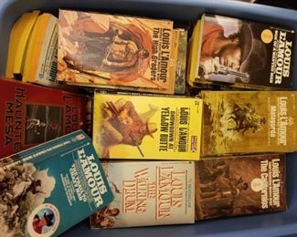 Bin full of Louis Lamour paperbacks