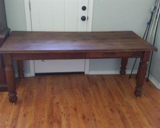 Solid wood table with a drawer on each side.