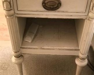 One of two French Provincial nightstands