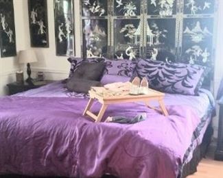 Awesome bed with large Asian headboard