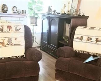 Two comfortable recliners and several vintage Mexican rugs