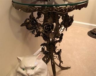 unique metal table and a cat you don't have to feed
