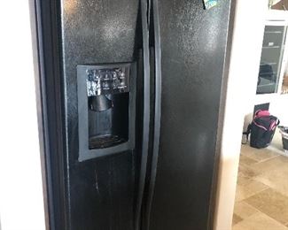 Black refrigerator - all the appliances in the house are for sale 