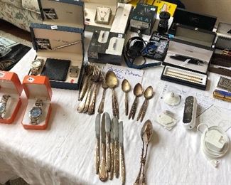 Loads of Watches, Silverplate Flatware, fine pens, Hats from LA Raiders, Oakland Raiders