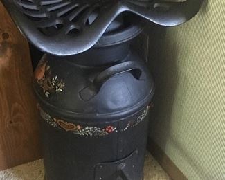 Antique milk jug modified with the addition of an antique tractor seat!