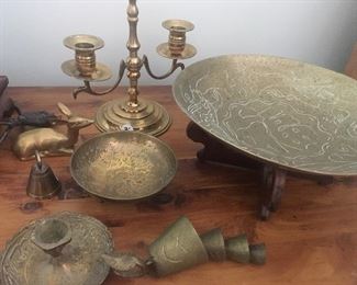 Collection of brass candlesticks and décor.