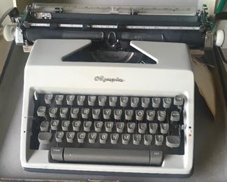 Vintage portable Olympia typewriter (needs servicing).