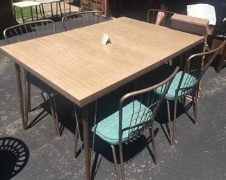Mid- century dining table: 5 chairs and two leaves (photo shows set up without the leaves in)