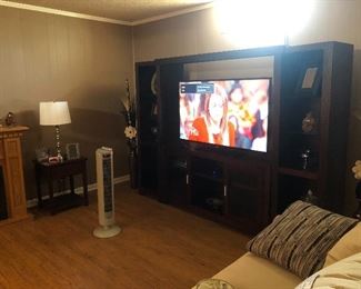 House 1: Large flat screen tv and entertainment center