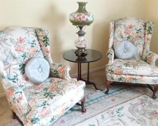 Bright cheerful colors and botanical designs cover these lovely wing chairs in excellent condition.  Fine furniture. 
