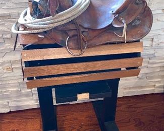 Vintage horse saddle and wooden saddle bag holder