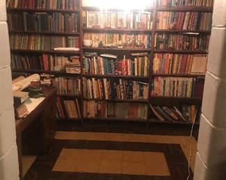 Basement library with tons of vintage & antique books.  They have been in this small room in the basement for 50+ years, so they are dank & musty.  These books will be sold at “give away” prices for that reason. 
