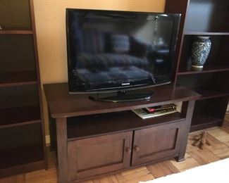 Flat screen tv with tv stand.