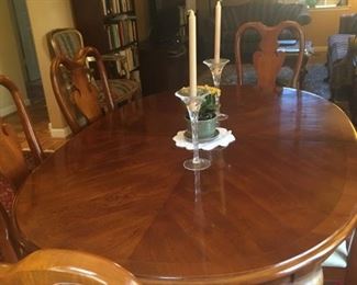 American Drew cherry dining room table set with 6 matching chairs -- leaves and pads included.  Seats up to 10.  