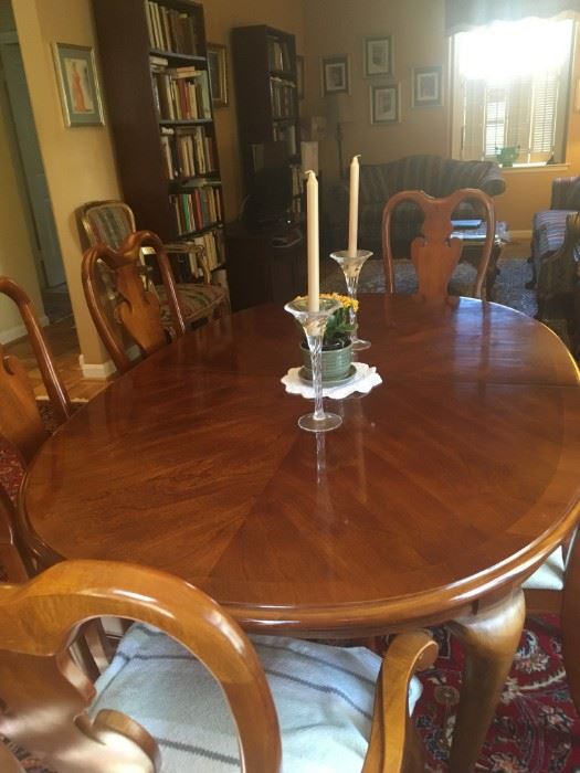 American Drew cherry dining room table set with 6 matching chairs -- leaves and pads included. Seats up to 10.