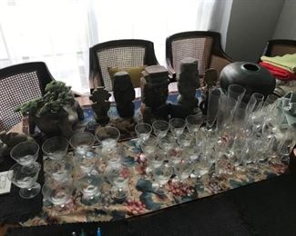 Crystal wine glasses, terra cotta sculptures