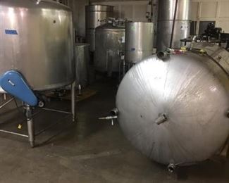 Stainless Steel Storage Tanks and Drums and Buckets. Diameter: 60 inches Height: 43 inches Volume in Gallons: 526  Agitator: Yes. Side entering. Manhole cover. Two 2 inch male and one 1 inch sanitary top connection. Discharge openings: Two  1.5 inch NPT. One 1 inch NPT bottom fittings. 