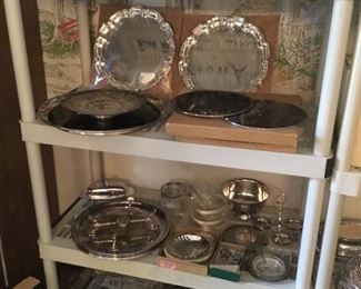 Lots of silver plated serving pieces, shaffing dishes, trays, baking dishes in silver stands....At a great price! most of those never used!