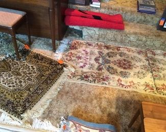 Assortment of rugs, each have a pair