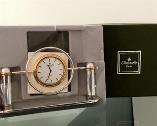 Silverplate and gold-tone metal Christofle desk clock with white dial, quartz movement, fabric lining at underside and brand stamp at base