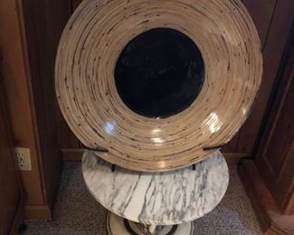 Large shallow bowl on marble stand