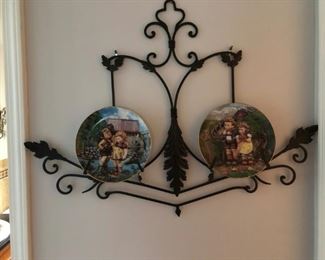 Collector plates on iron wall display